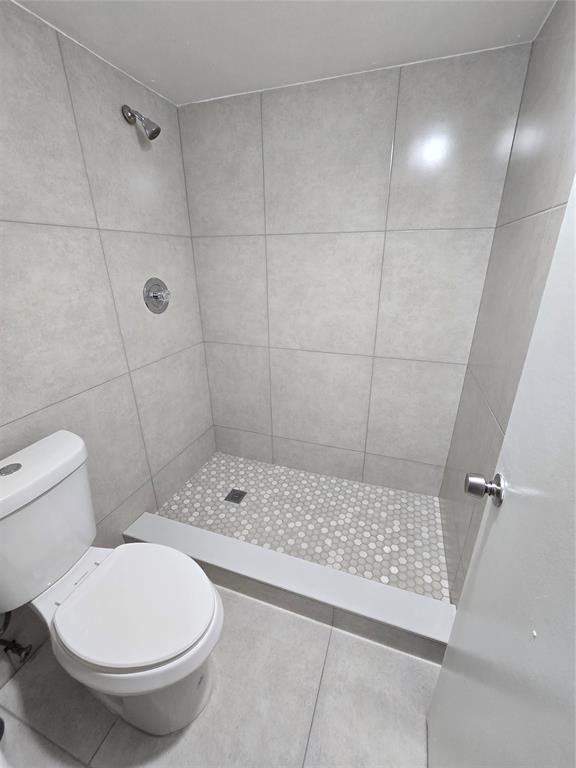 1681 Northwest 70th Avenue, Unit 403 Plantation, FL 33313 - Photo 34 of 54 a bathroom with a toilet and a shower