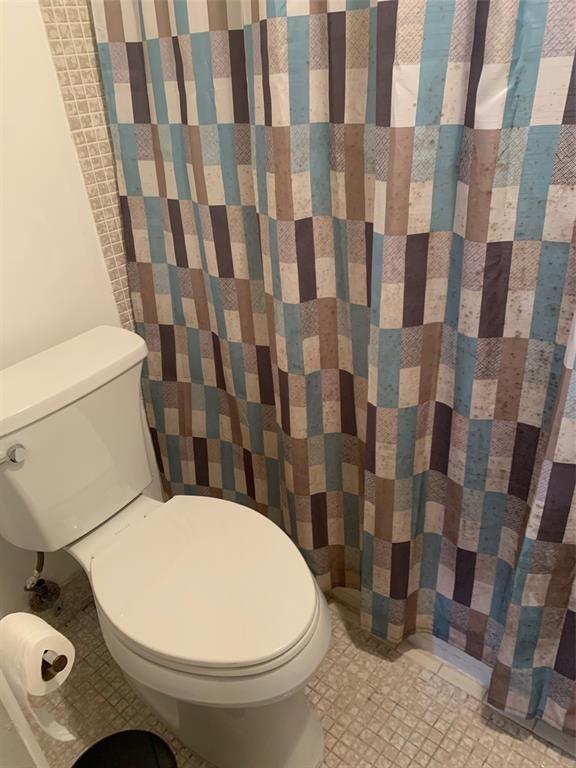 1681 Northwest 70th Avenue, Unit 403 Plantation, FL 33313 - Photo 37 of 54 a bathroom with a sink and toilet