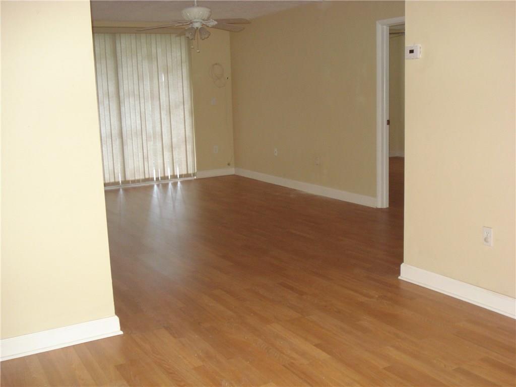 1681 Northwest 70th Avenue, Unit 403 Plantation, FL 33313 - Photo 4 of 54 a view of a livingroom with wooden floor