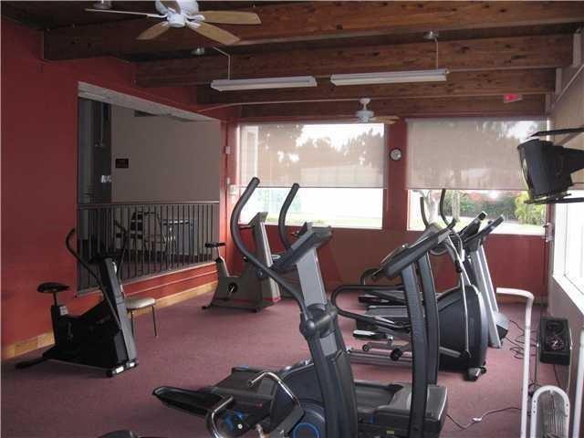 1681 Northwest 70th Avenue, Unit 403 Plantation, FL 33313 - Photo 51 of 54 a view of a room with gym equipment