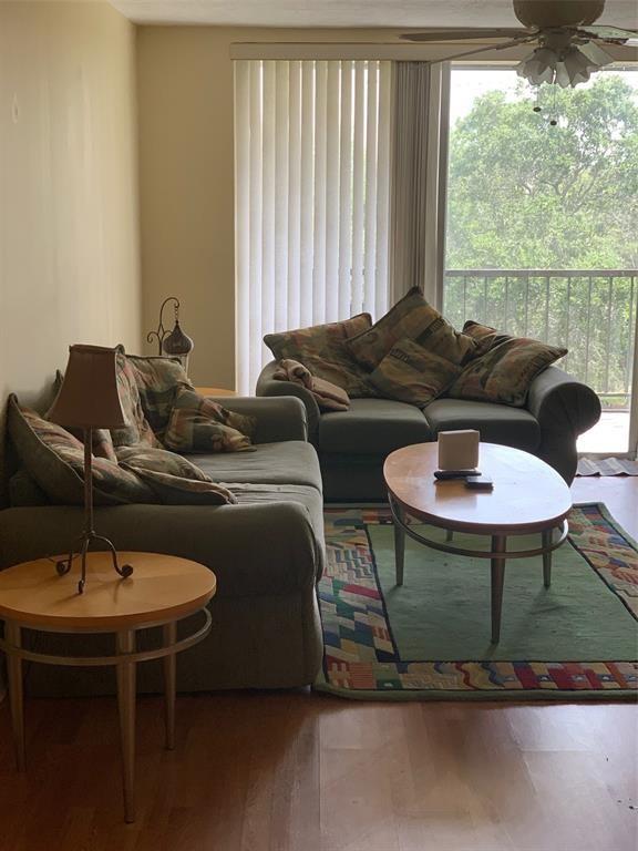 1681 Northwest 70th Avenue, Unit 403 Plantation, FL 33313 - Photo 7 of 54 a living room with furniture and a window