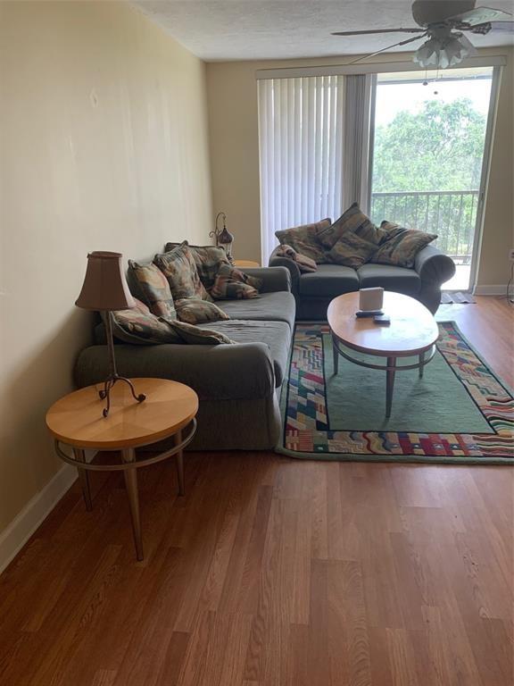 1681 Northwest 70th Avenue, Unit 403 Plantation, FL 33313 - Photo 8 of 54 a living room with furniture and a large window