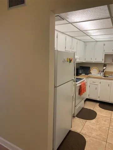 a kitchen with a stove and cabinets
