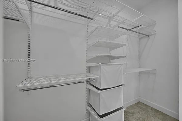 a front view of a house with parking area