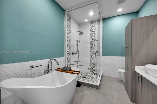 an aerial view of multiple houses with yard