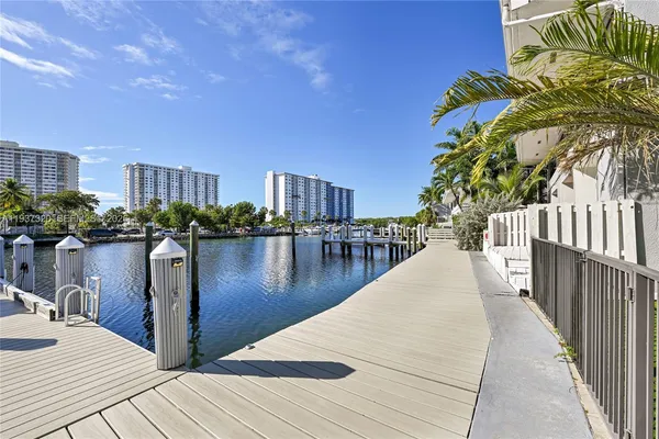 a view of a balcony with two chairs