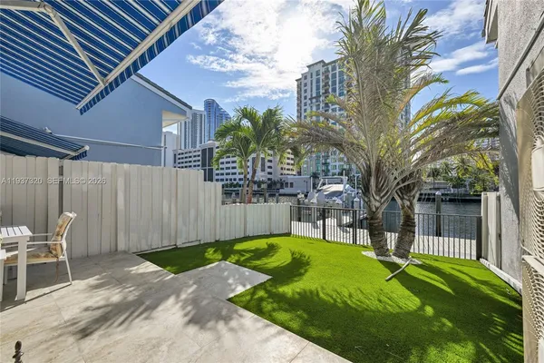 a view of a house with swimming pool and porch