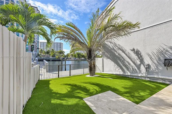 a view of a backyard with sitting area