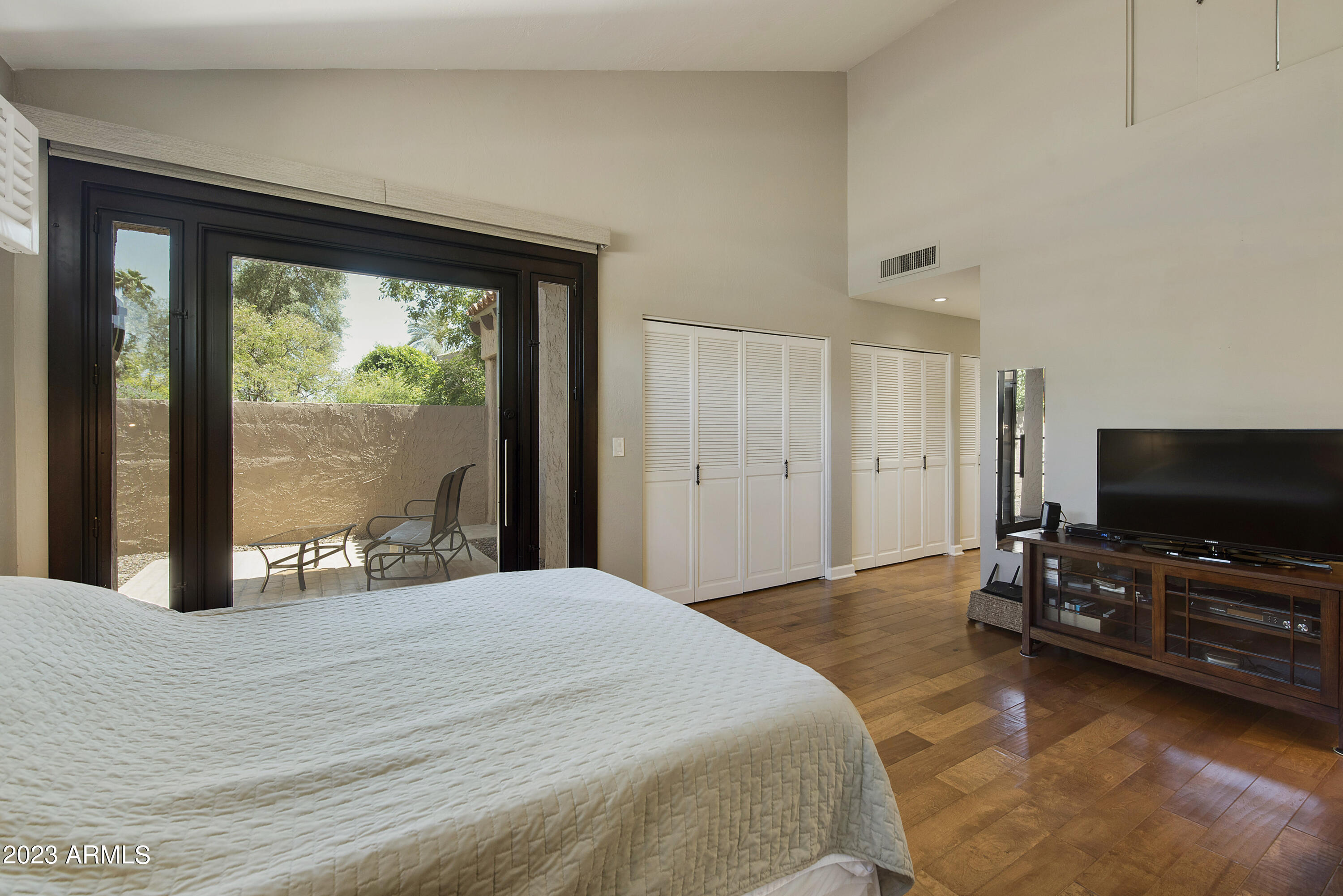4442 East Camelback Road, Unit 163 Phoenix, AZ 85018 - Photo 13 of 38 Primary Bedroom to Patio