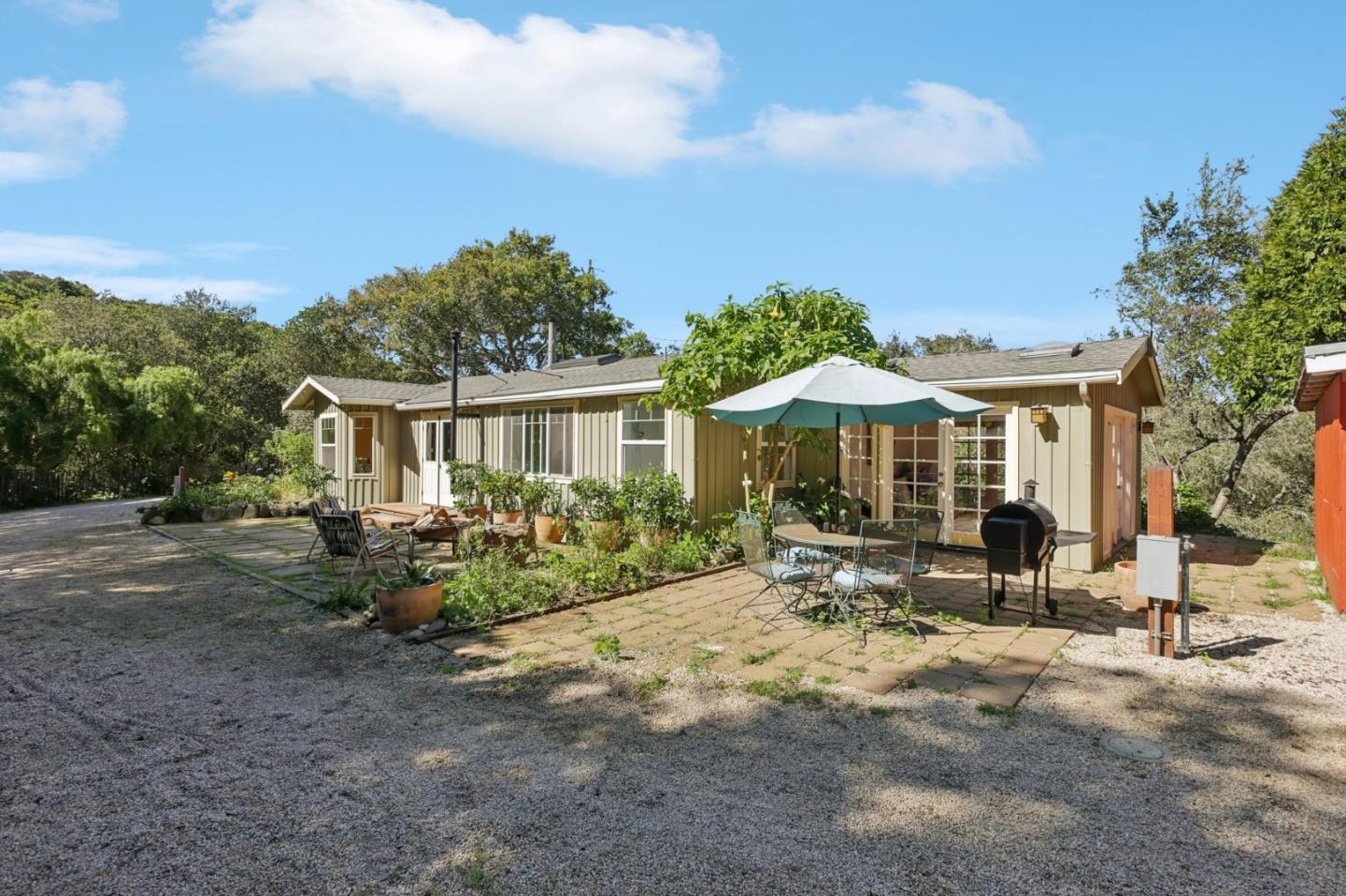 122 Strawberry Road Watsonville, CA 95076 - Photo 3 of 57 a front view of a house with garden