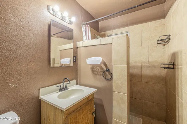 a bathroom with a sink and mirror