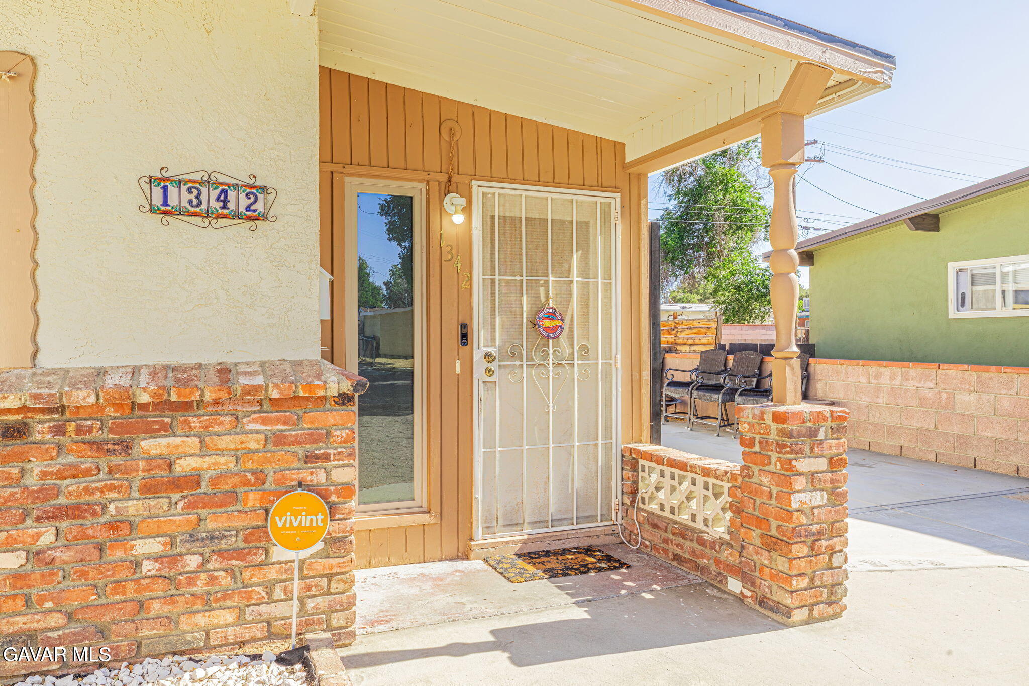 1342 Ave H 15 Lancaster, CA 93534 - Photo 2 of 15 a view of a patio with table and chairs and potted plants