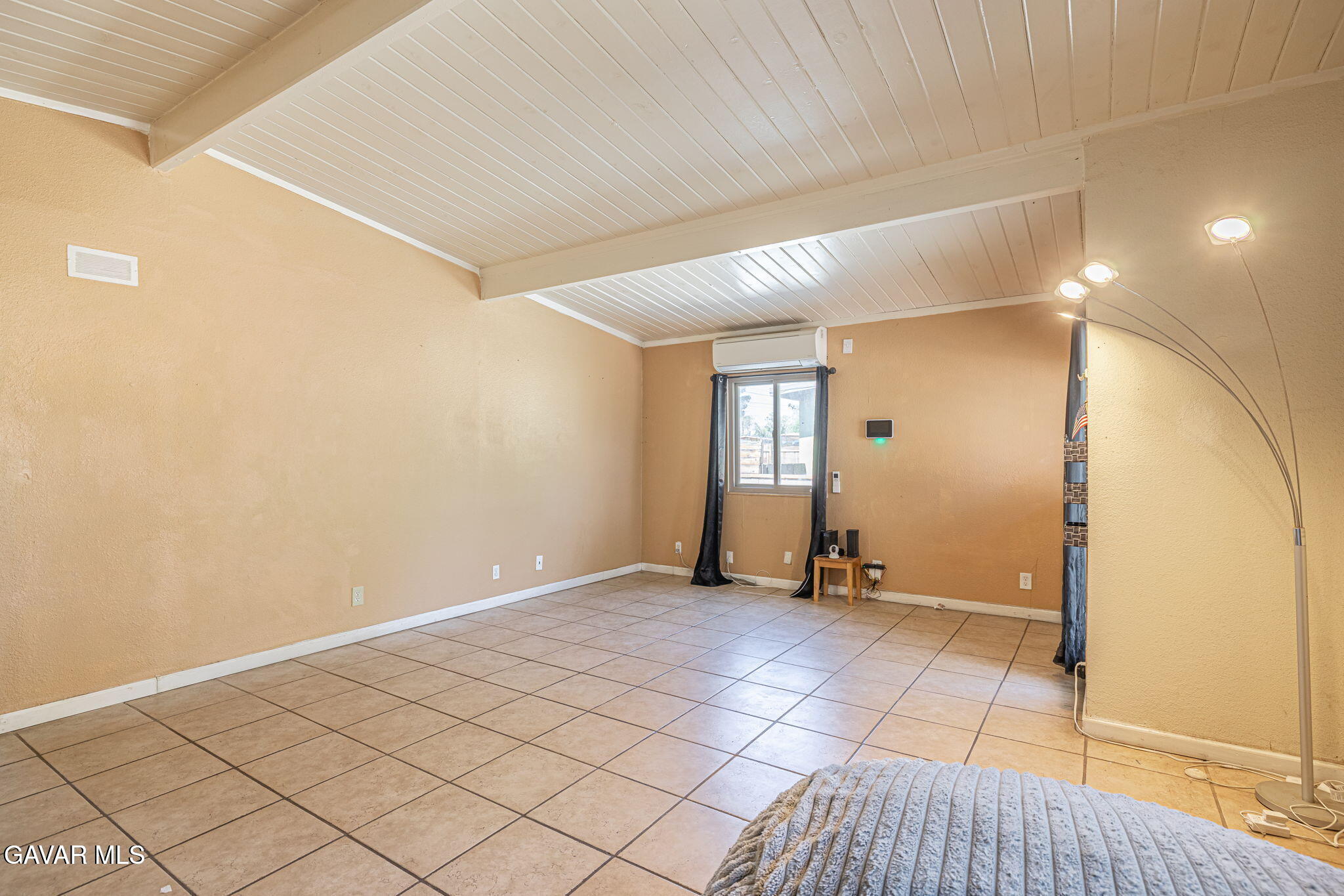 1342 Ave H 15 Lancaster, CA 93534 - Photo 4 of 15 a view of an empty room and window