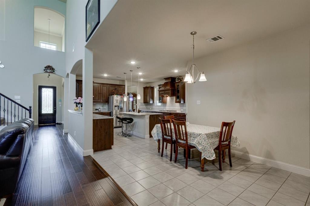336 Red Hill Road Sunnyvale, TX 75182 - Photo 9 of 36 a dining room with furniture and wooden floor