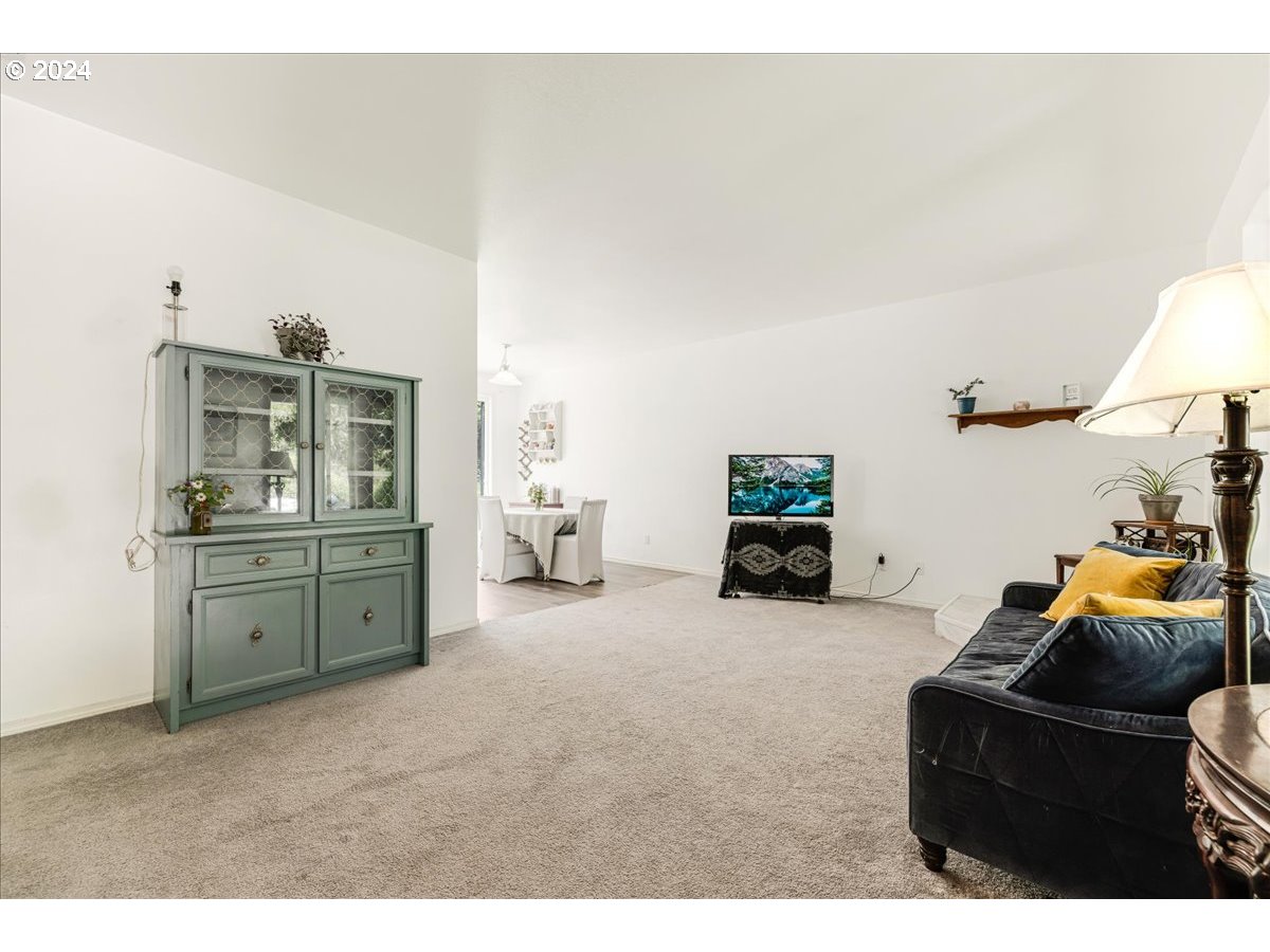 8445 King Road Grand Ronde, OR 97347 - Photo 9 of 38 a living room with furniture and a flat screen tv