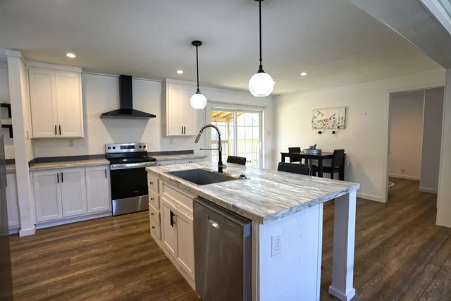 a bathroom with 2 sink and a mirror