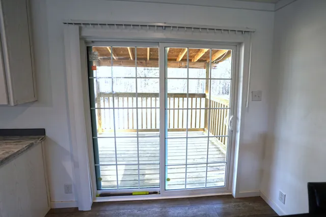 a view of a room that has a table and chair in it
