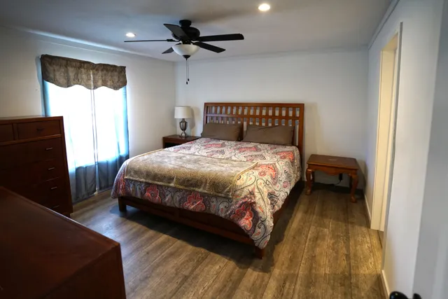 a view of an empty room and wooden floor