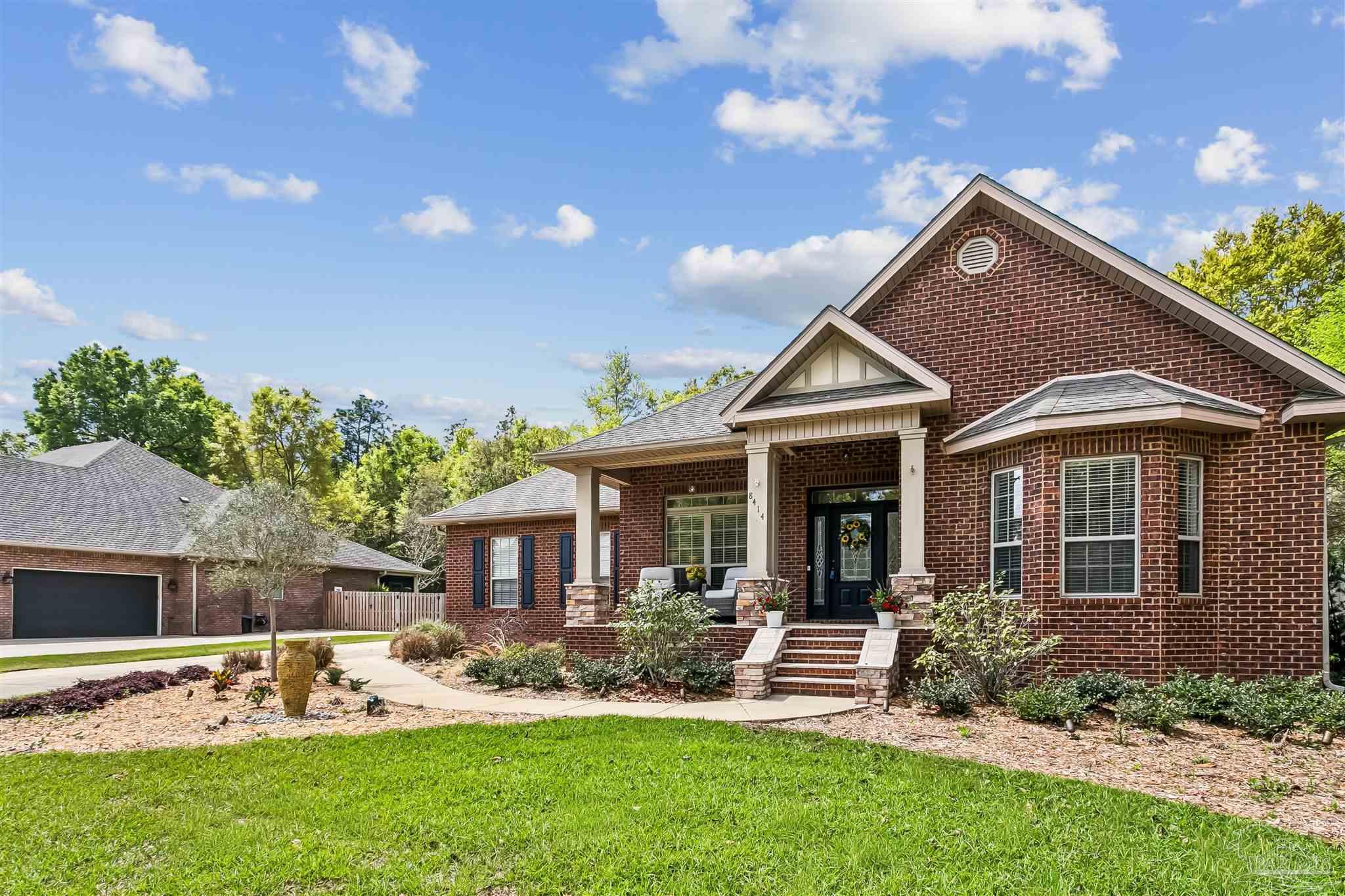 8414 Foxtail Loop Pensacola, FL 32526 - Photo 21 of 22 a view of a house with a yard and plants