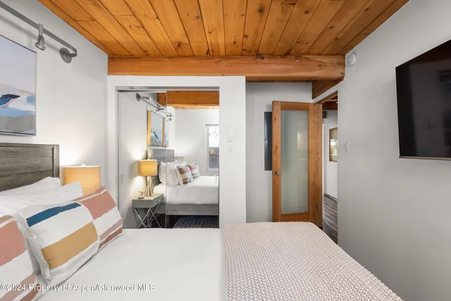 a view of living room filled with furniture and a flat screen tv