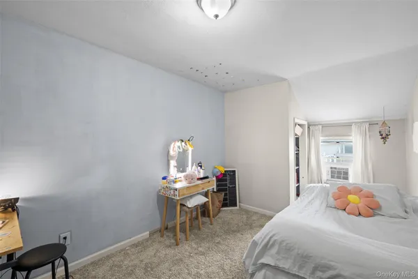 a bedroom with a bed and a table in it