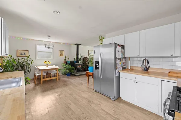 a kitchen with stainless steel appliances a refrigerator and a sink