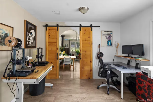 a view of a workspace with furniture and a livingroom