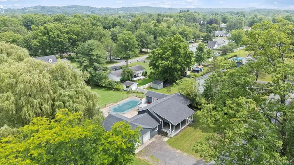 an aerial view of a house with yard and outdoor space