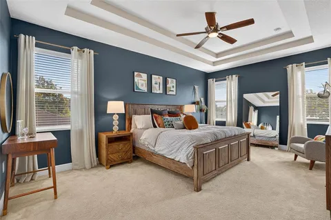 a bed room with a bed and a chair