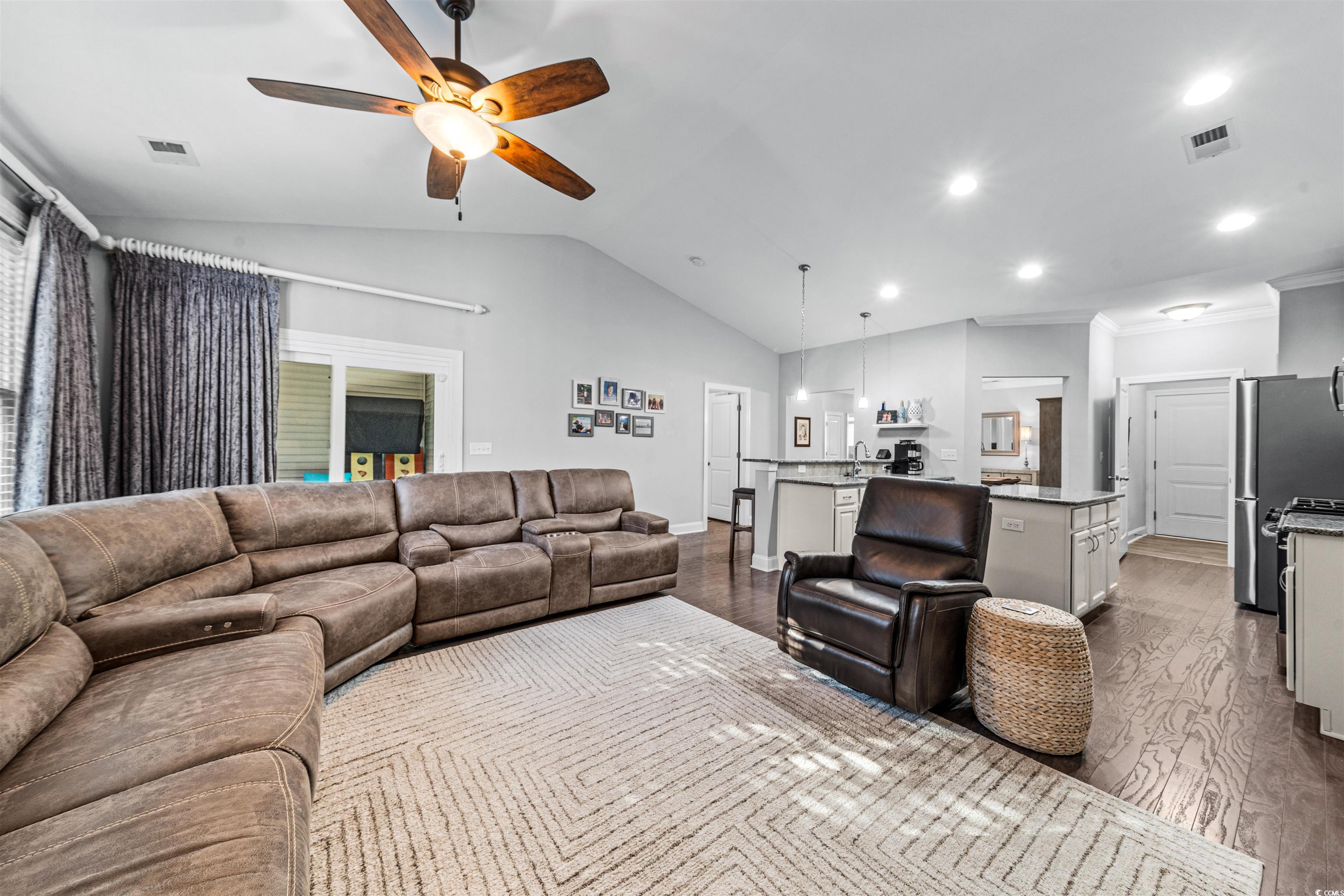 136 Parmelee Drive, Unit C Murrells Inlet, SC 29576 - Photo 13 of 40 Living area featuring dark wood finished floors, ceiling fan, vaulted ceiling, and recessed lighting