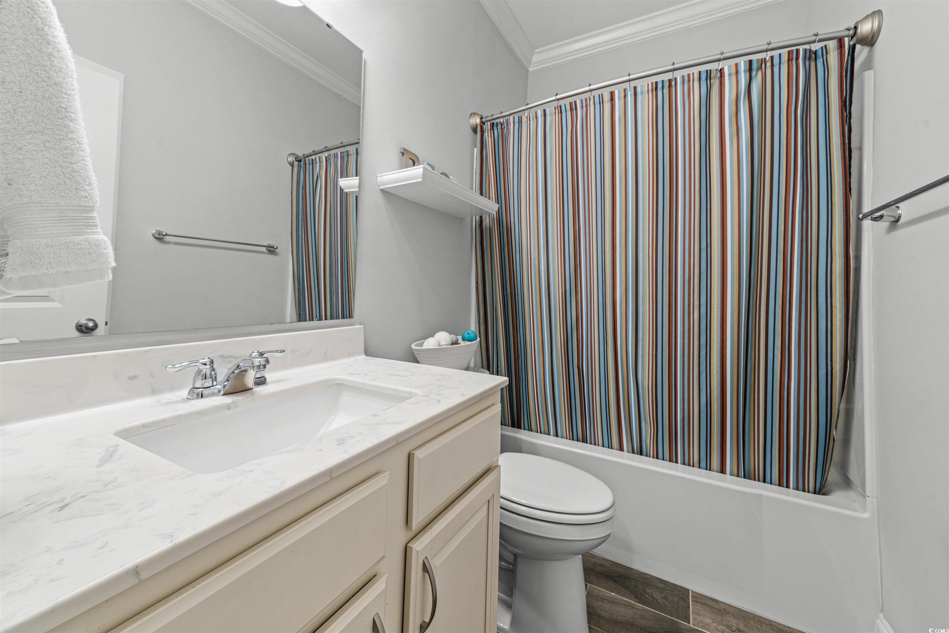 136 Parmelee Drive, Unit C Murrells Inlet, SC 29576 - Photo 6 of 40 Full bath with shower / tub combo with curtain, ornamental molding, and vanity