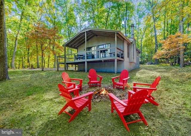 a view of a yard with furniture and garden