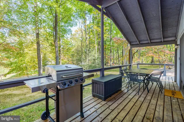 a view of a chairs and table in the balcony
