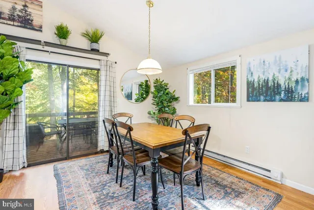 a dining room with furniture and window