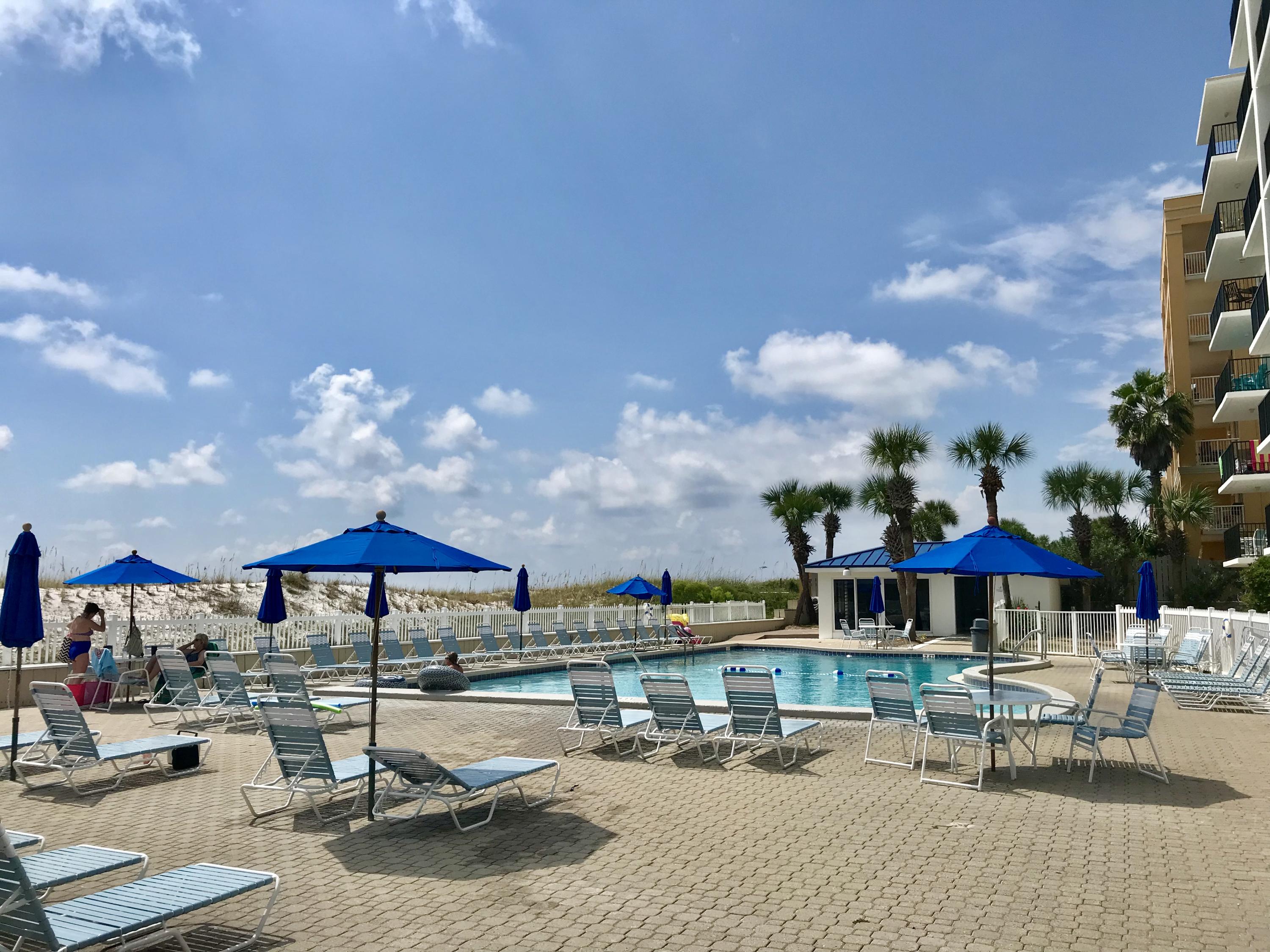 1114 Santa Rosa Boulevard, Unit 102 Fort Walton Beach, FL 32548 - Photo 15 of 23 a swimming pool with outdoor seating and yard