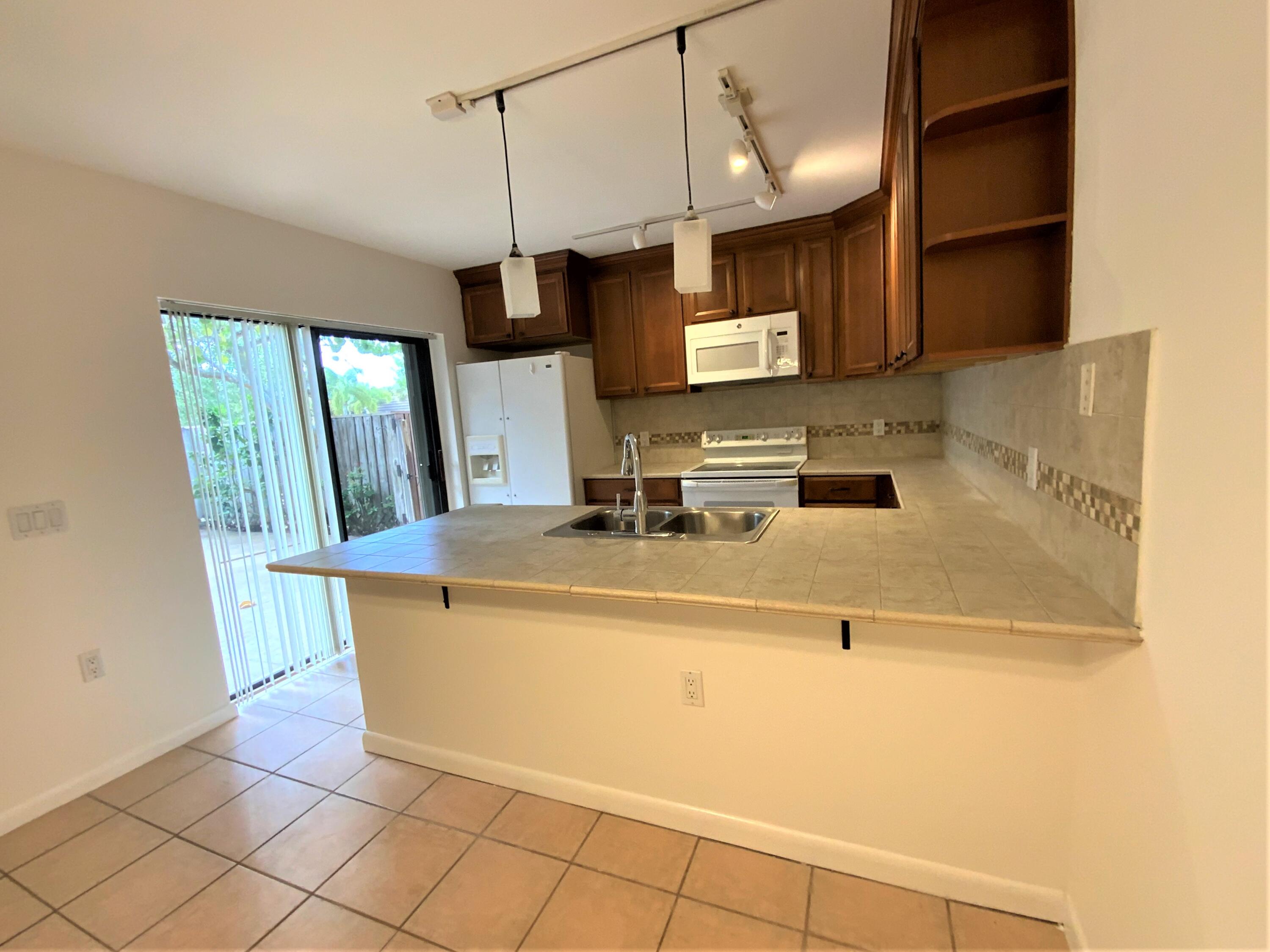 1221 12th Court Jupiter, FL 33477 - Photo 4 of 18 1221 12th Ct kitchen 2