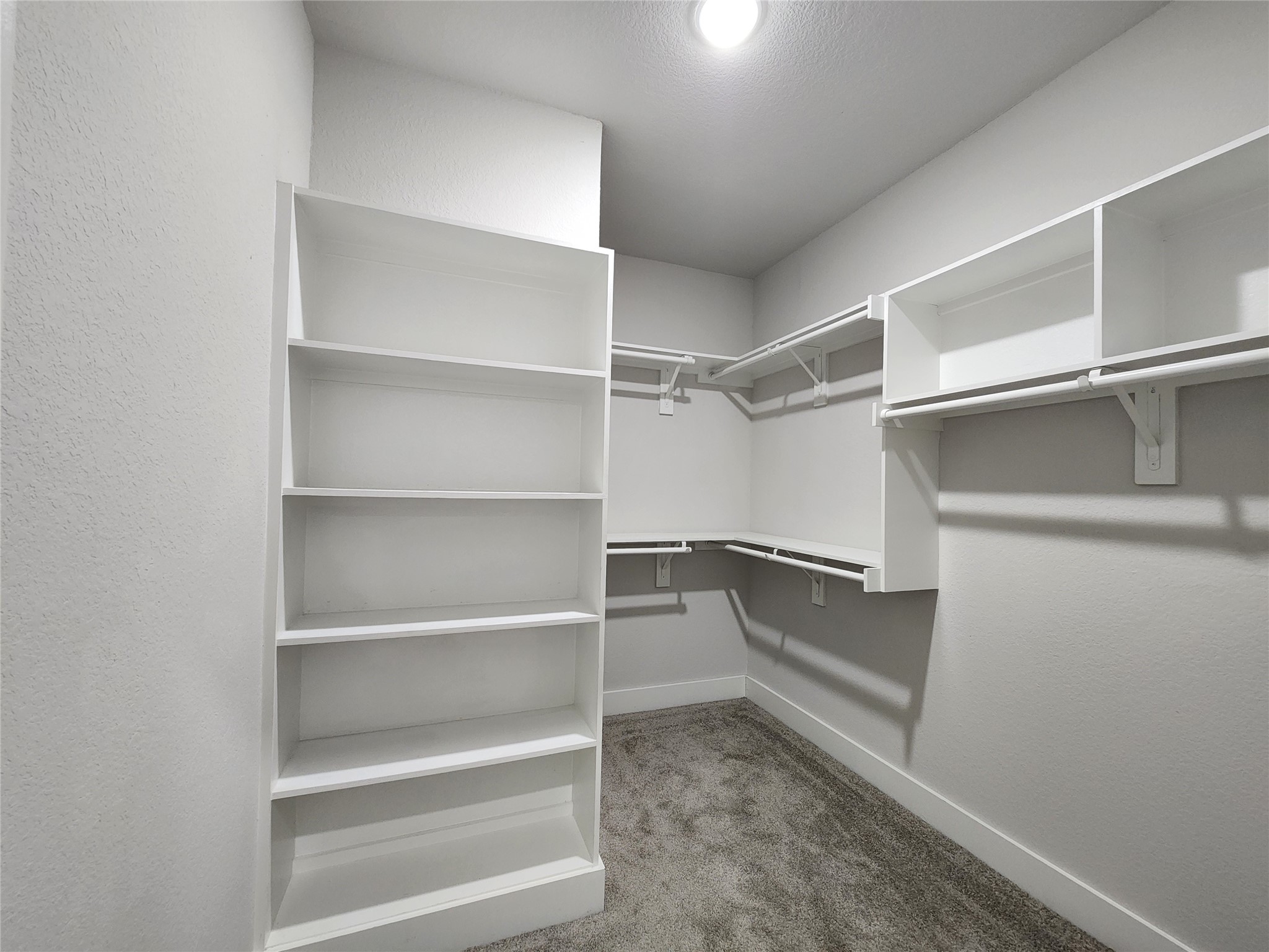 9710 Tuffly Street, Unit B Houston, TX 77029 - Photo 9 of 14 a view of walk in closet with empty racks
