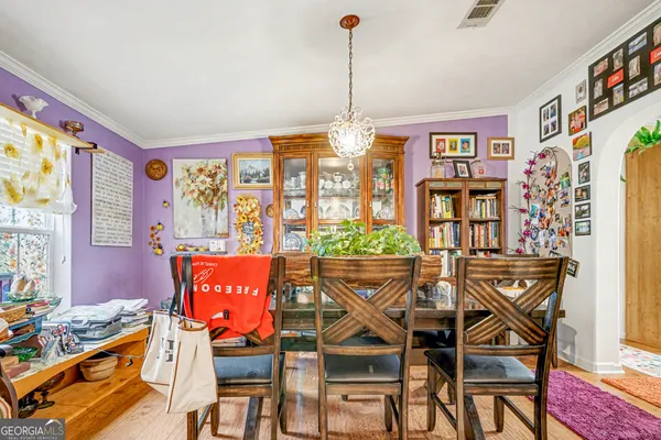 a view of a dining room with furniture window and outside view