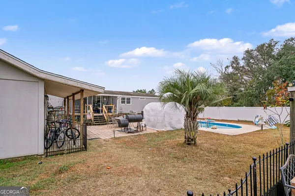 a house view with a backyard space