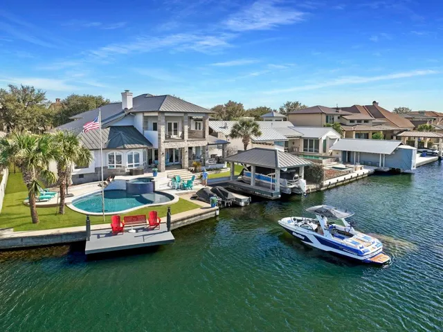 a swimming pool with outdoor seating and yard