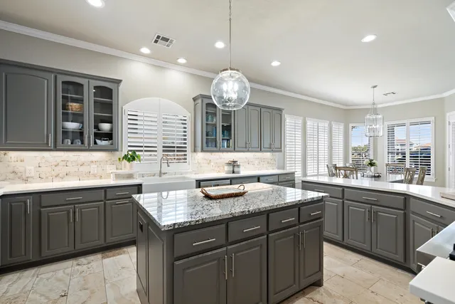 a kitchen with a sink and cabinets