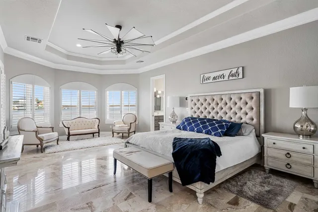 a bathroom with a tub a sink shower and a mirror
