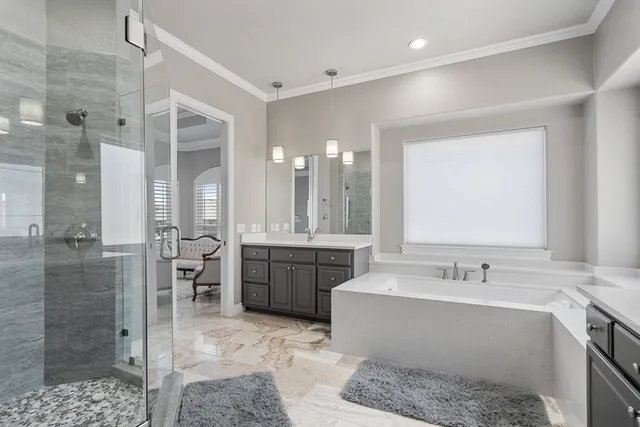 a view of a workspace with furniture and a window in a room