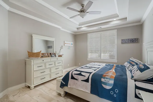 a view of a livingroom with furniture hardwood floor and a large window