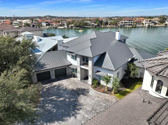 an aerial view of a house with wooden floor and outdoor space
