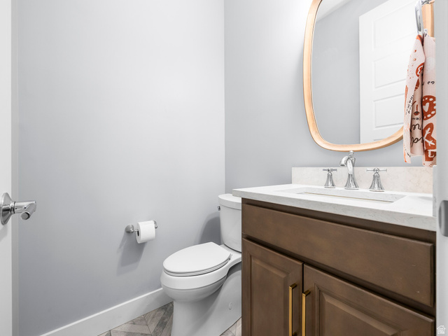 877 South Yarrow Drive Mapleton, UT 84664 - Photo 17 of 46 Bathroom vanity with a light-colored countertop, undermount sink, and chrome fixtures