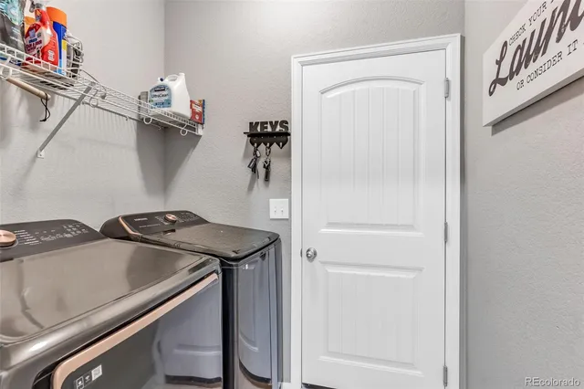 a utility room with dryer and washer