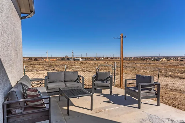 a view of a terrace with chairs