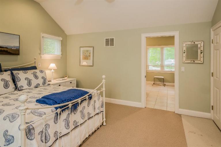70 Fells Pond Road Mashpee, MA 02649 - Photo 18 of 34 a living room with furniture a flat screen tv and a table