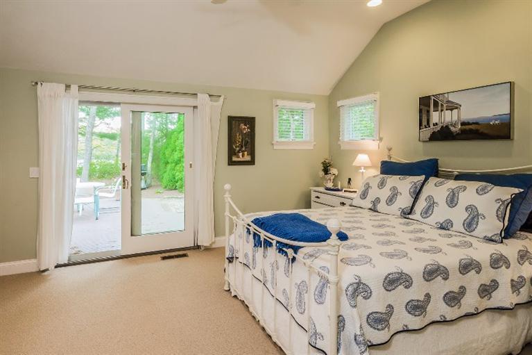 70 Fells Pond Road Mashpee, MA 02649 - Photo 19 of 34 a spacious bedroom with a bed and a window